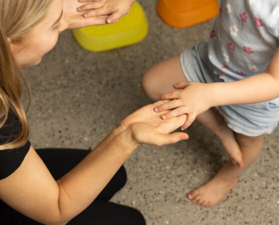 Paediatric physiotherapist treating a young girl