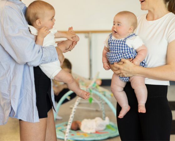 Mothers and their babies chatting outside The Studio creche